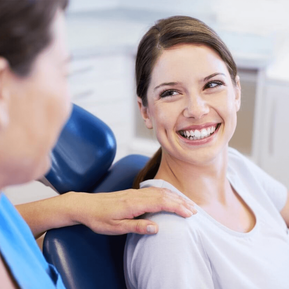 Woman having her teeth checked