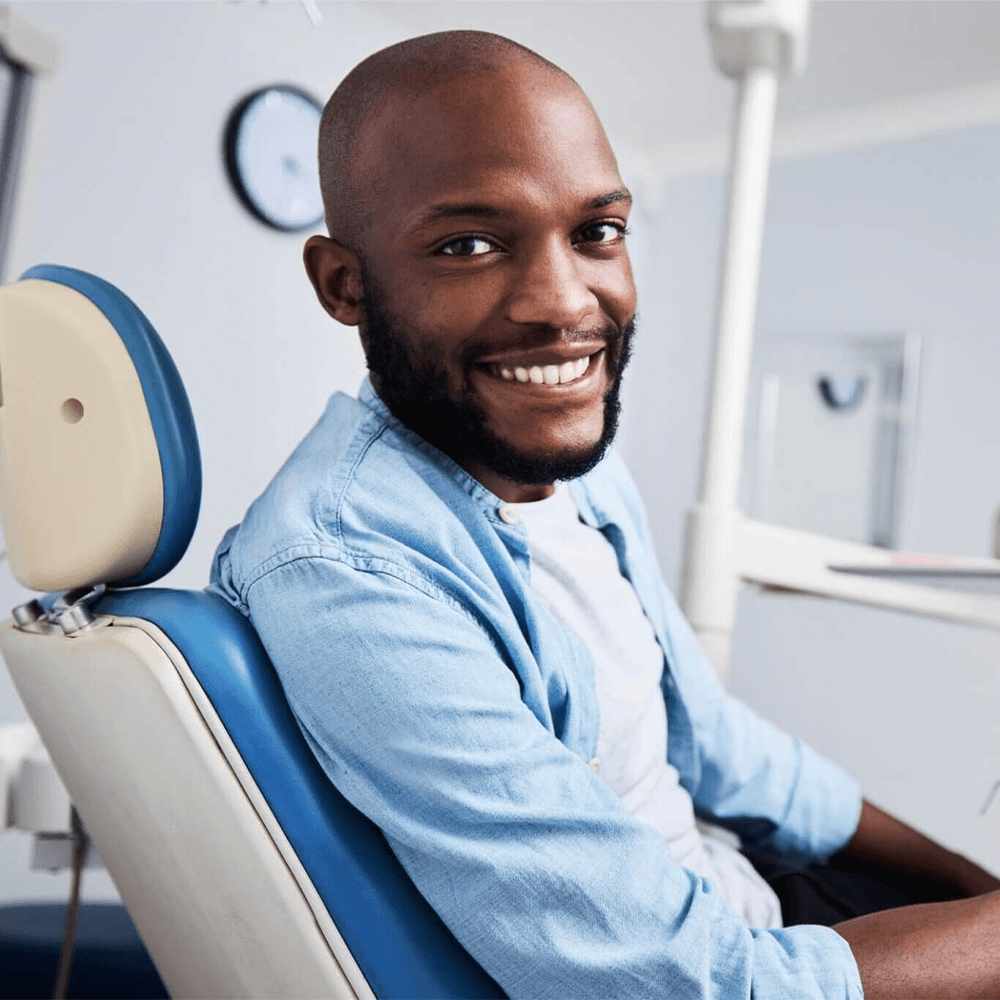 Guy smiling after dental service