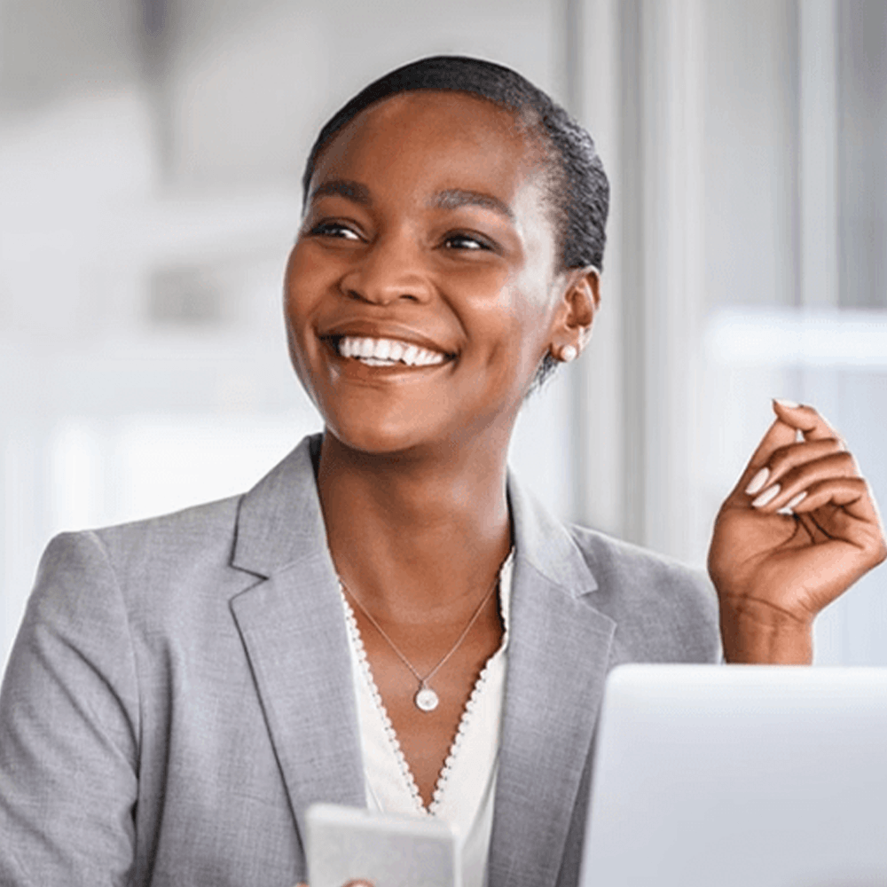 Woman smiling while holding papers